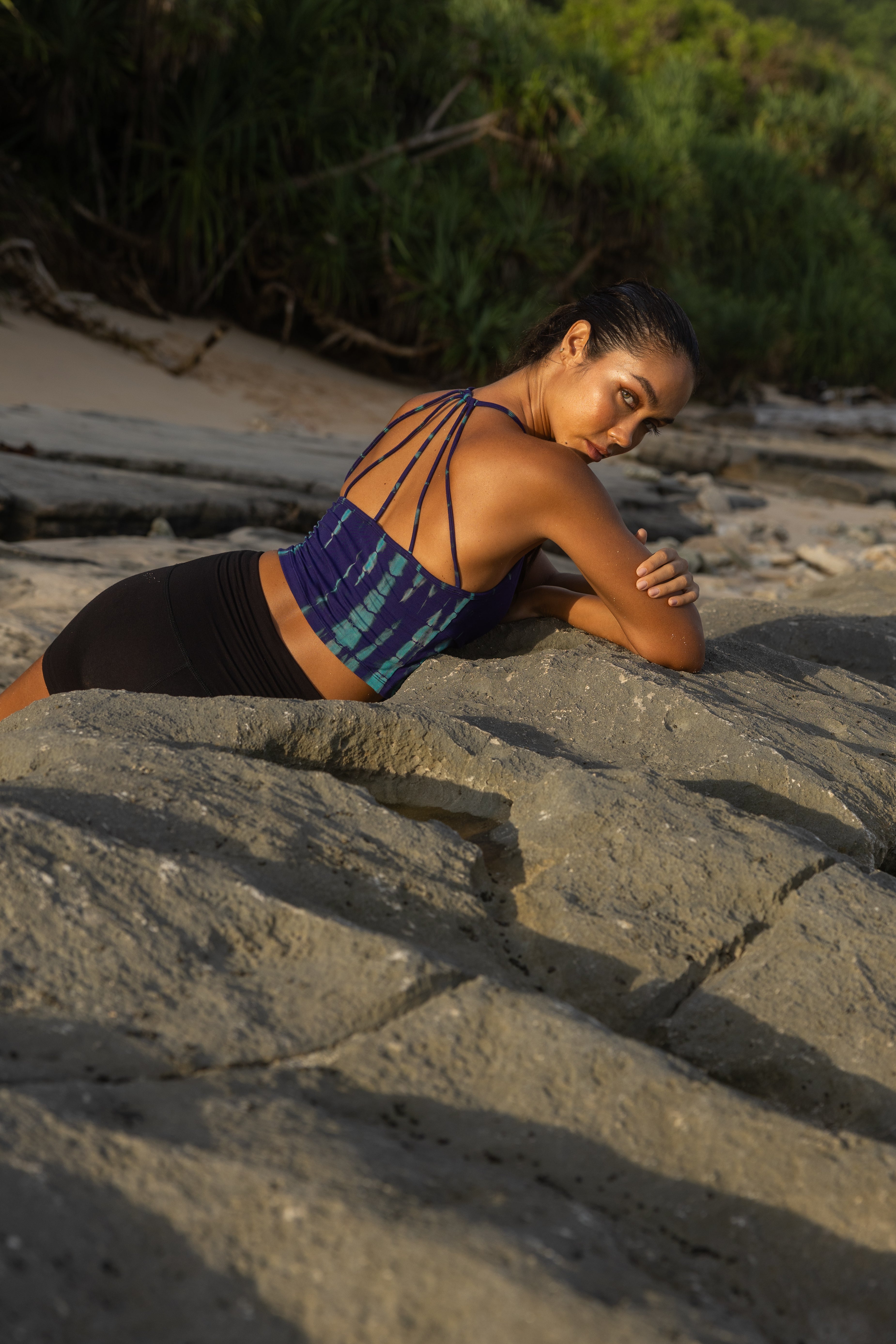 Outdoor lifestyle photo of bamboo blend halter tank top with cinch-front detail